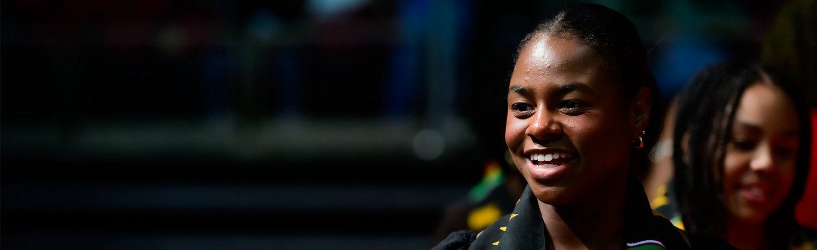 student smiling while graduating